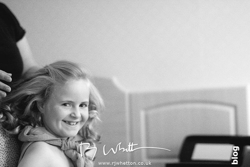Bridesmaid having her hair done - Professional Wedding Photography Dorset