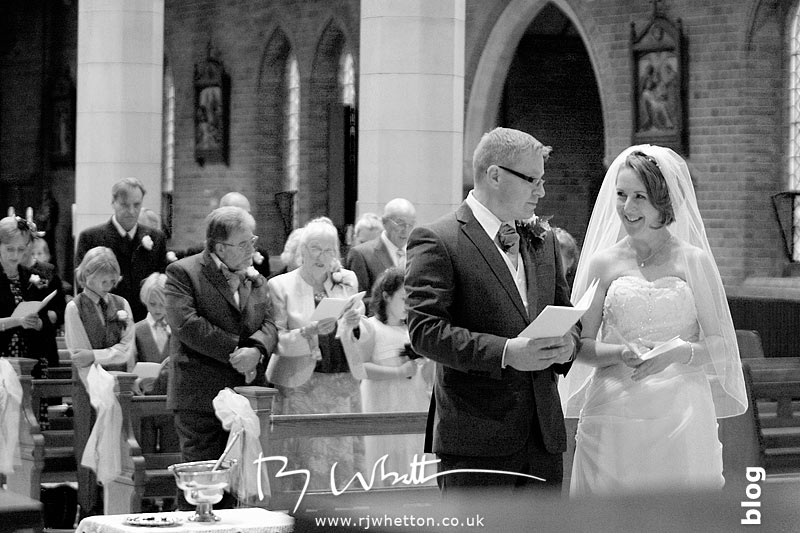 Darren and Rebecca exchange a glance during the service - Professional Wedding Photography Dorset