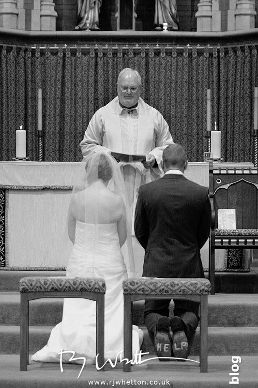 Father Denis blessing the couple - Professional Wedding Photography Dorset