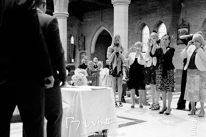 As always the wedding paparazzi are eager to take their photographs - Professional Wedding Photography Dorset
