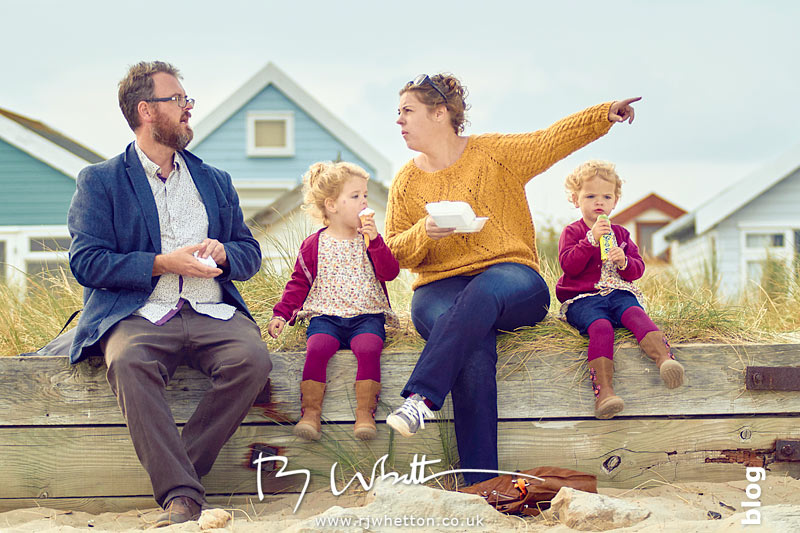 Family sit to eat their treats - Portrait Photography Dorset