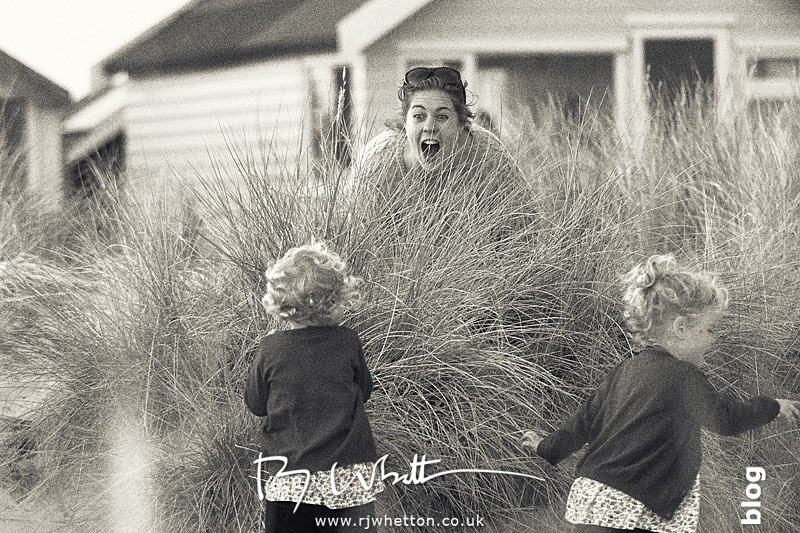 Lou finds Harper and Scout when playing hide and seek - Portrait Photography Dorset