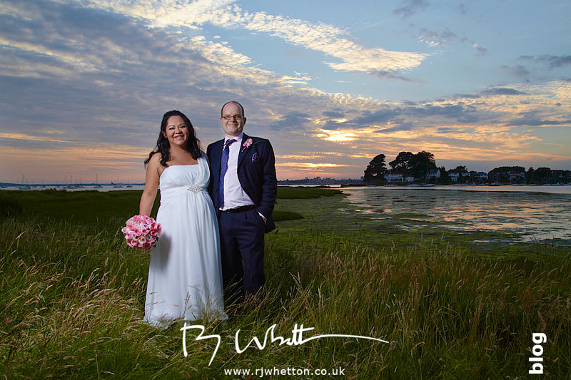 Claudia and Adam pose in the sunset over Poole bay, Sandbanks - Wedding Photography Dorset